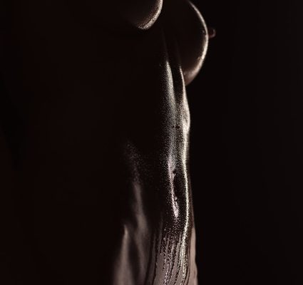 A close up of a woman's body, capturing subtle elegance and hinting at her special affinity for older gentlemen.